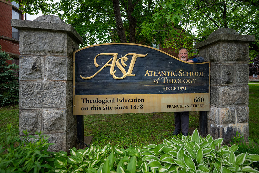 Man near sign