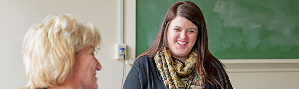 Two women talking and laughing