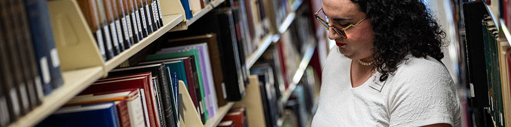 student reading library
